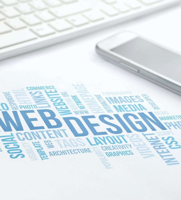 Web Design business concept word cloud print document, keyboard, pen and smartphone